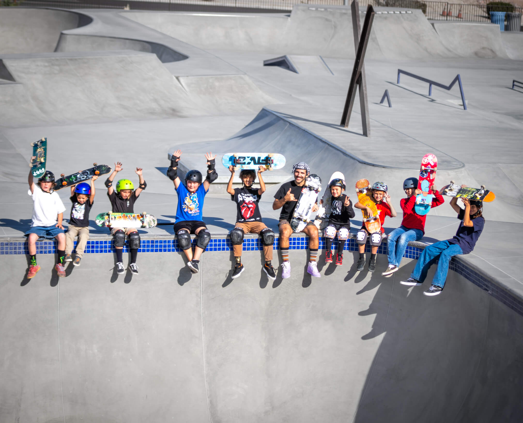 Camp participants together with their skateboards at an APA skatepark.